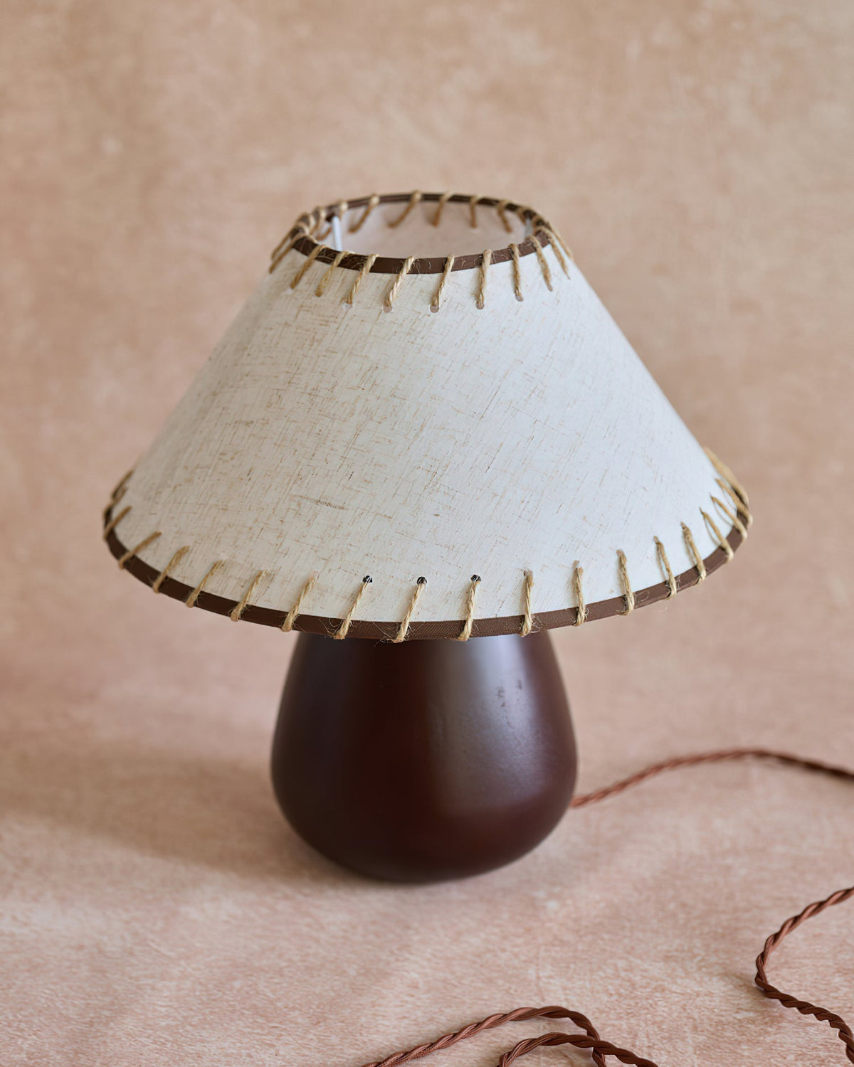 Model A of the Douglas Table Lamp shown for scale in a minimalist setting.