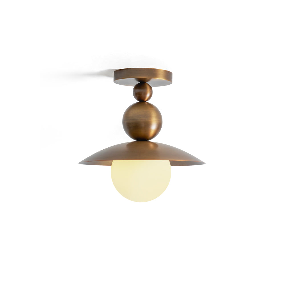 Sasco Flush Mount in antique brass finish, angled view.