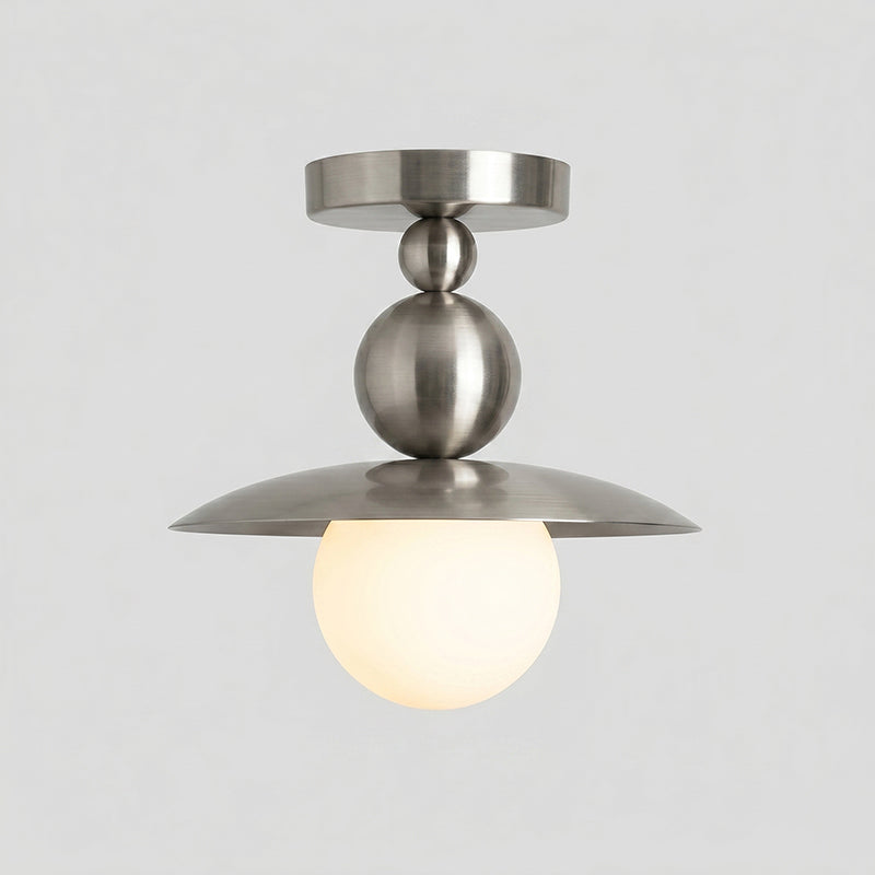 The light from the Sasco Flush Mount casting a warm glow.