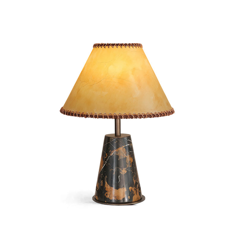 Angled view highlighting the texture of the marble base and parchment shade.