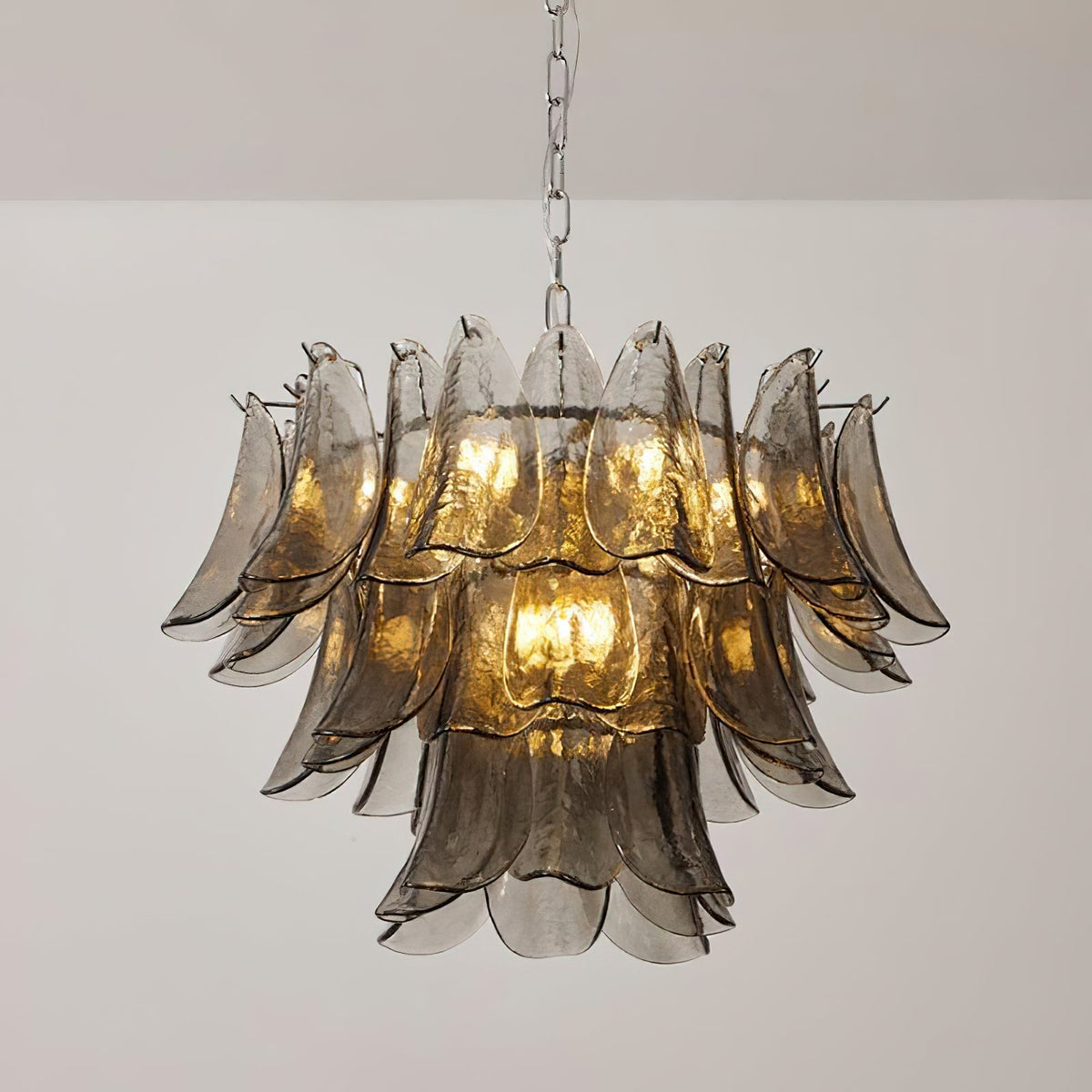 The medium 12-light Vivienne chandelier illuminating a high-ceiling foyer.