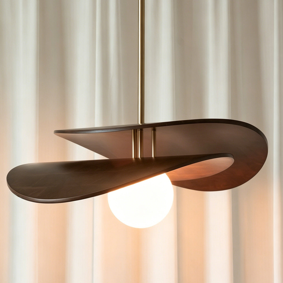 The Zane pendant light hanging in a high-ceiling entryway.