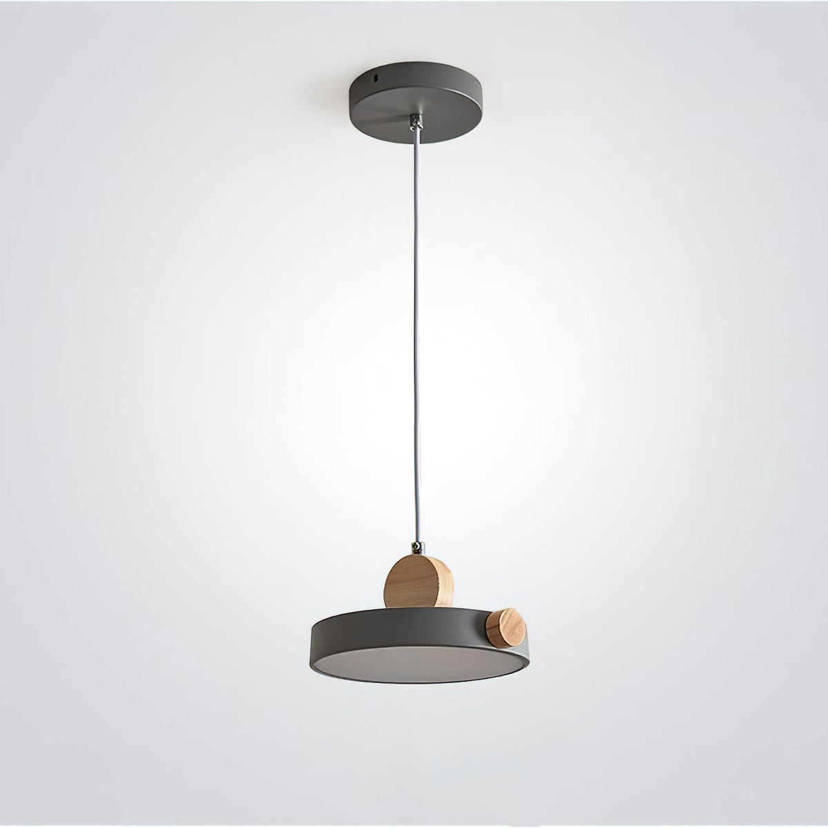 Lifestyle image of the Detroit Pendant Light over a dining table.