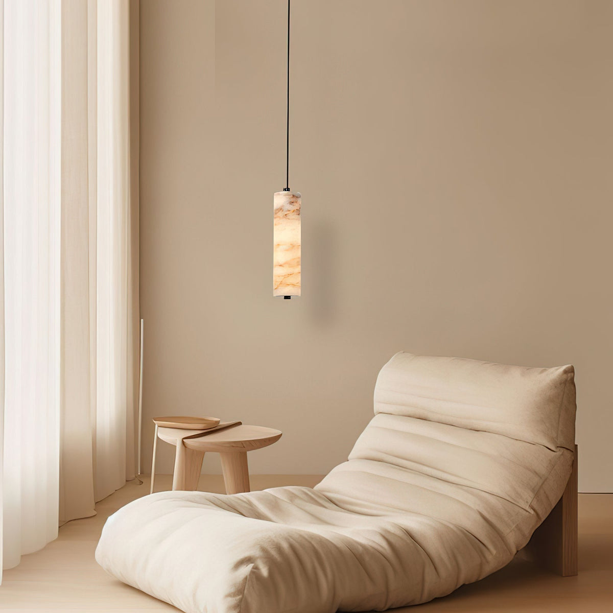 A series of Devane Alabaster Pendant Lights hanging over a modern kitchen island.