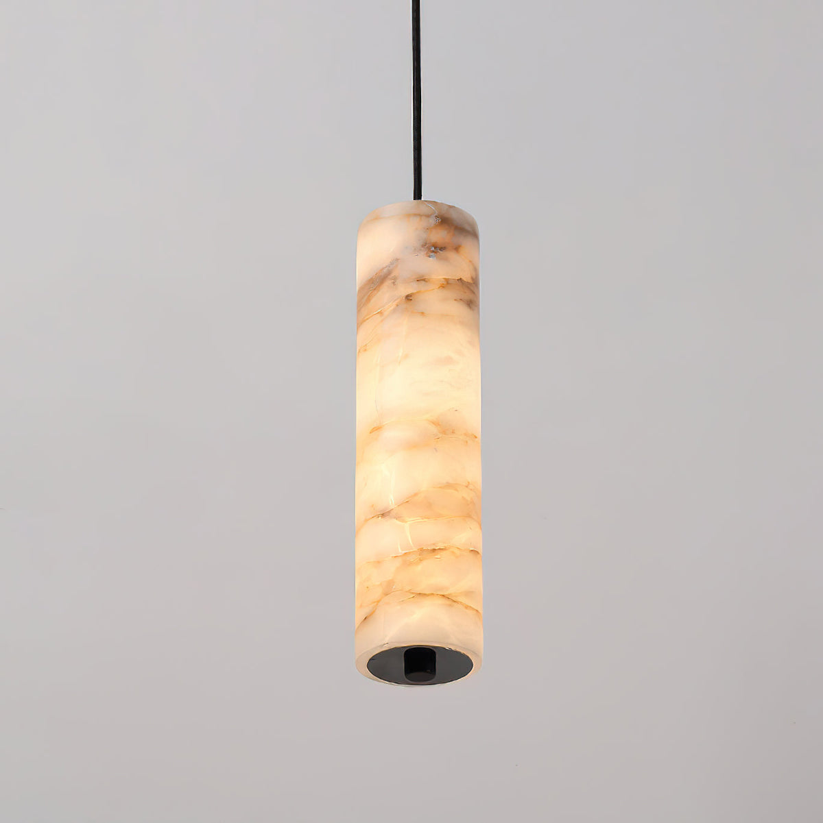 The 3-light linear configuration of the Devane Alabaster Pendant Light.