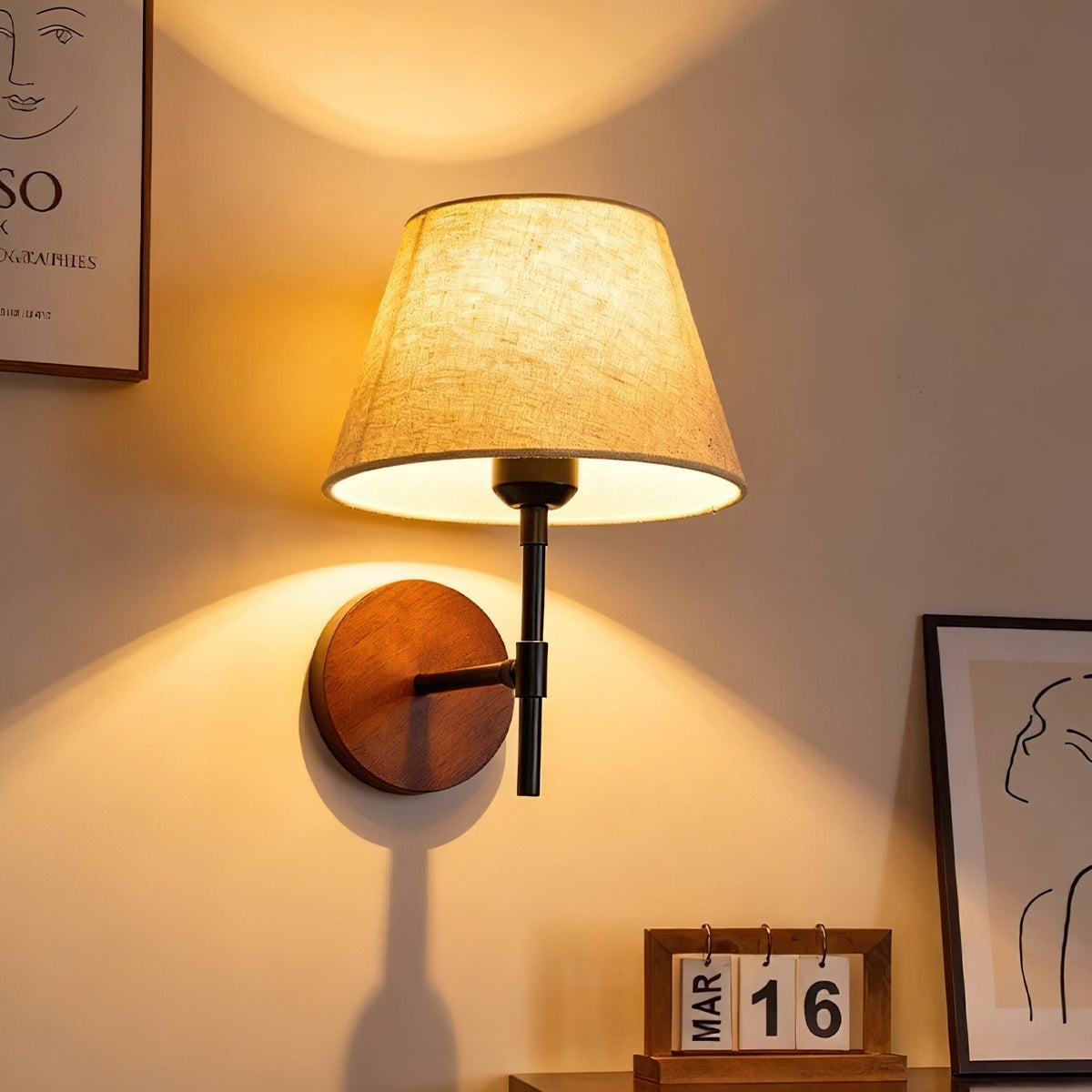 The Dodie Wall Light turned on, casting a warm and inviting glow.