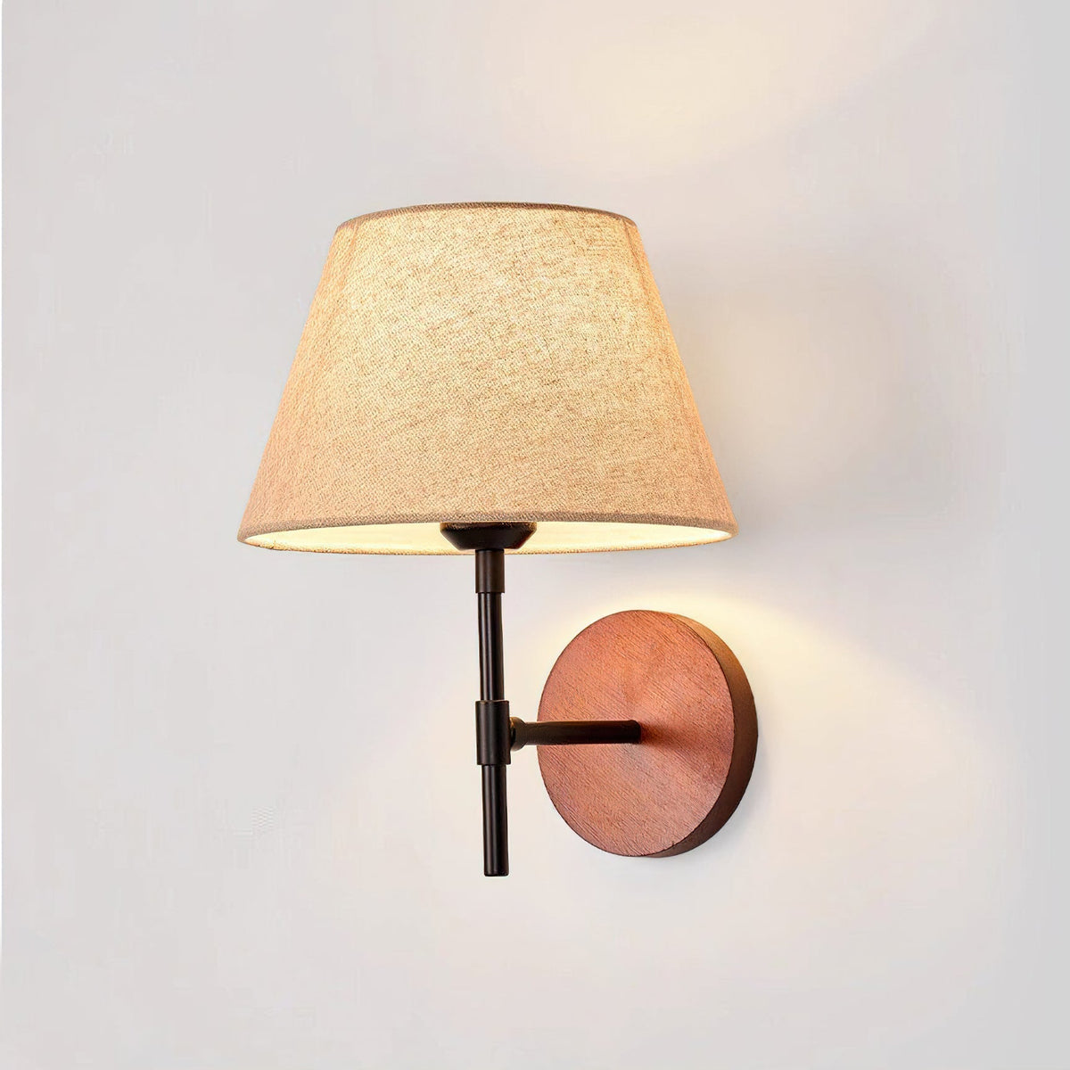 Lifestyle image showing the Dodie Wall Light mounted next to a bed.