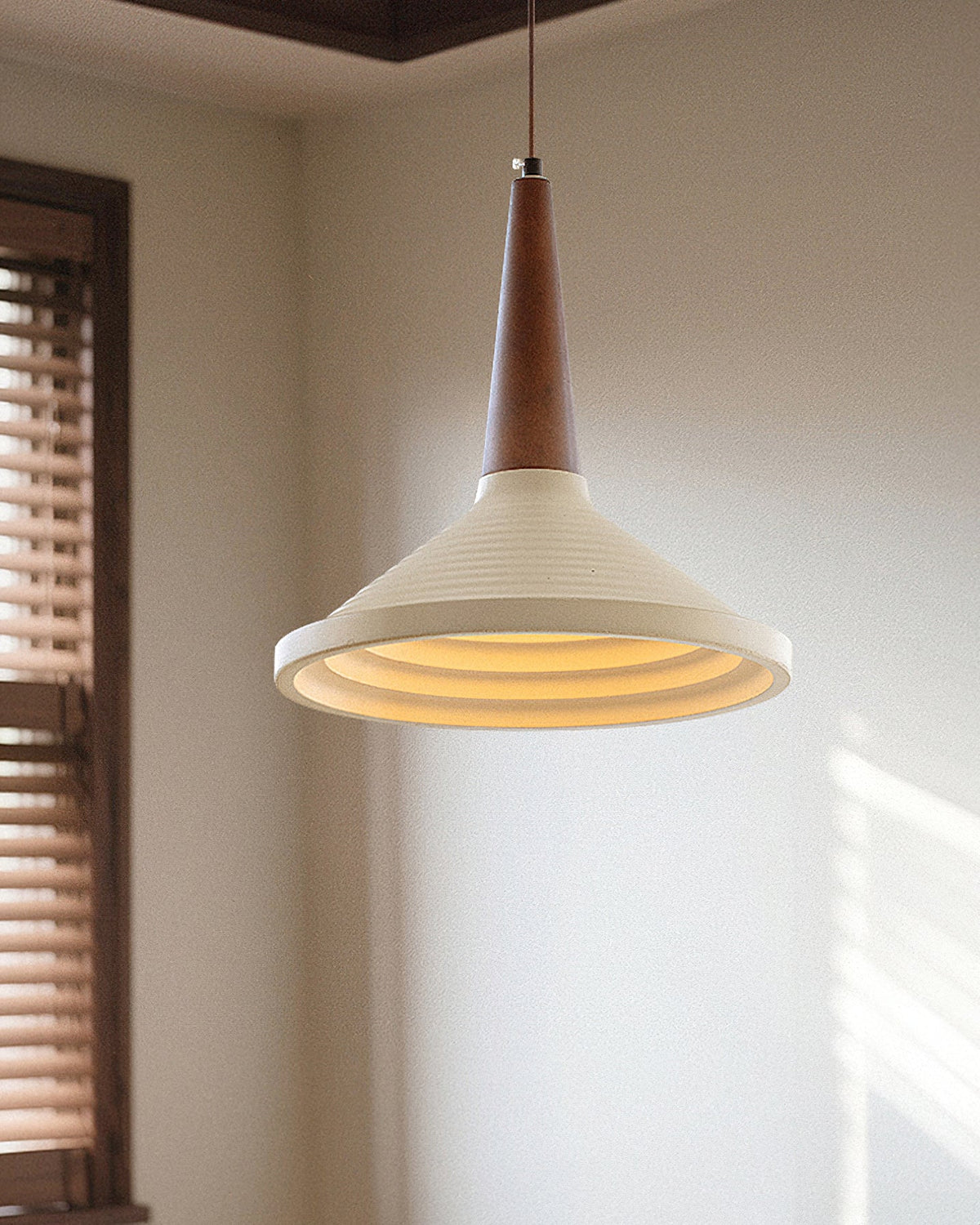 All three color variations of the Doherty Pendant Light shown together.