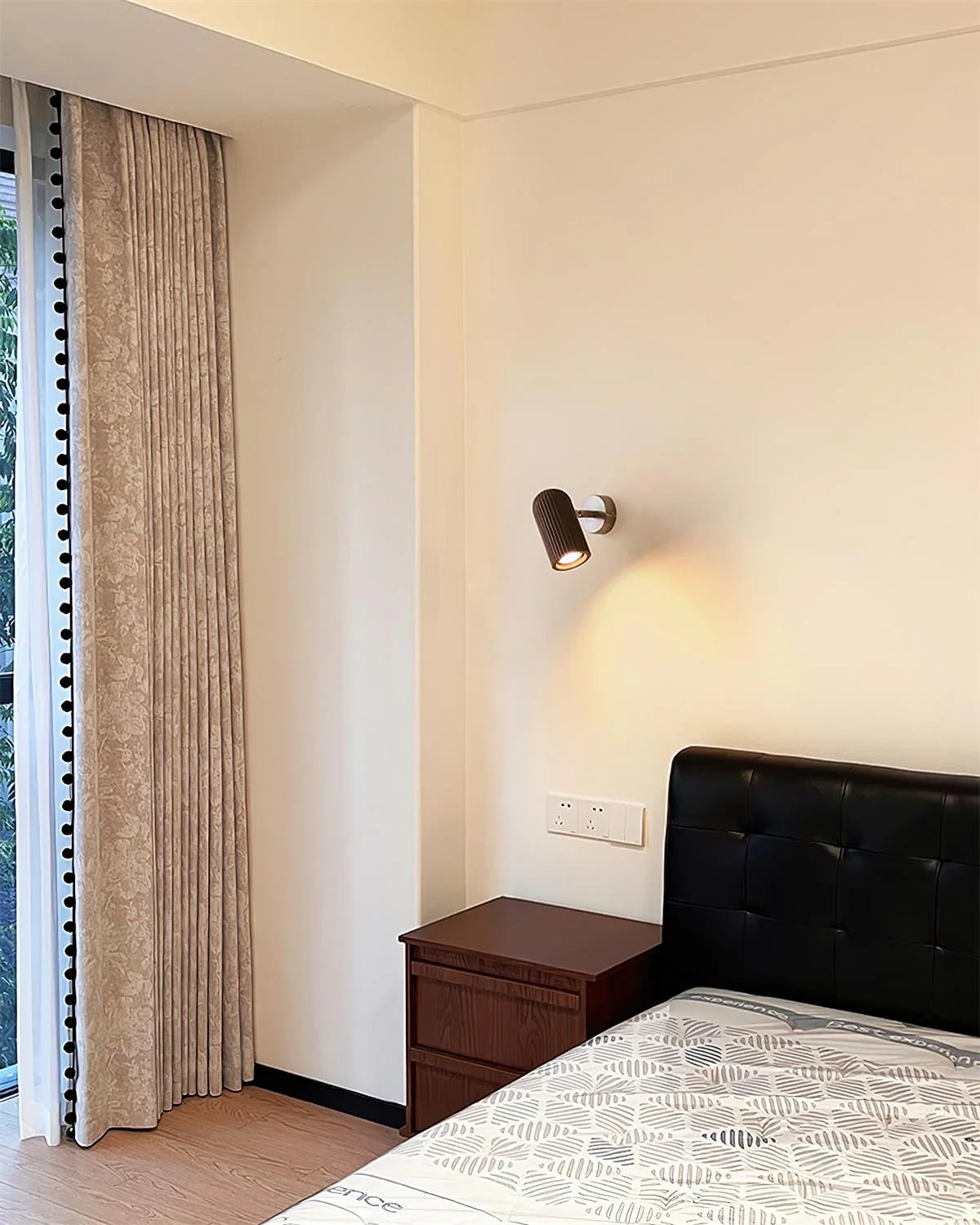 Donovan Wall Lamp in a rich walnut color finish.
