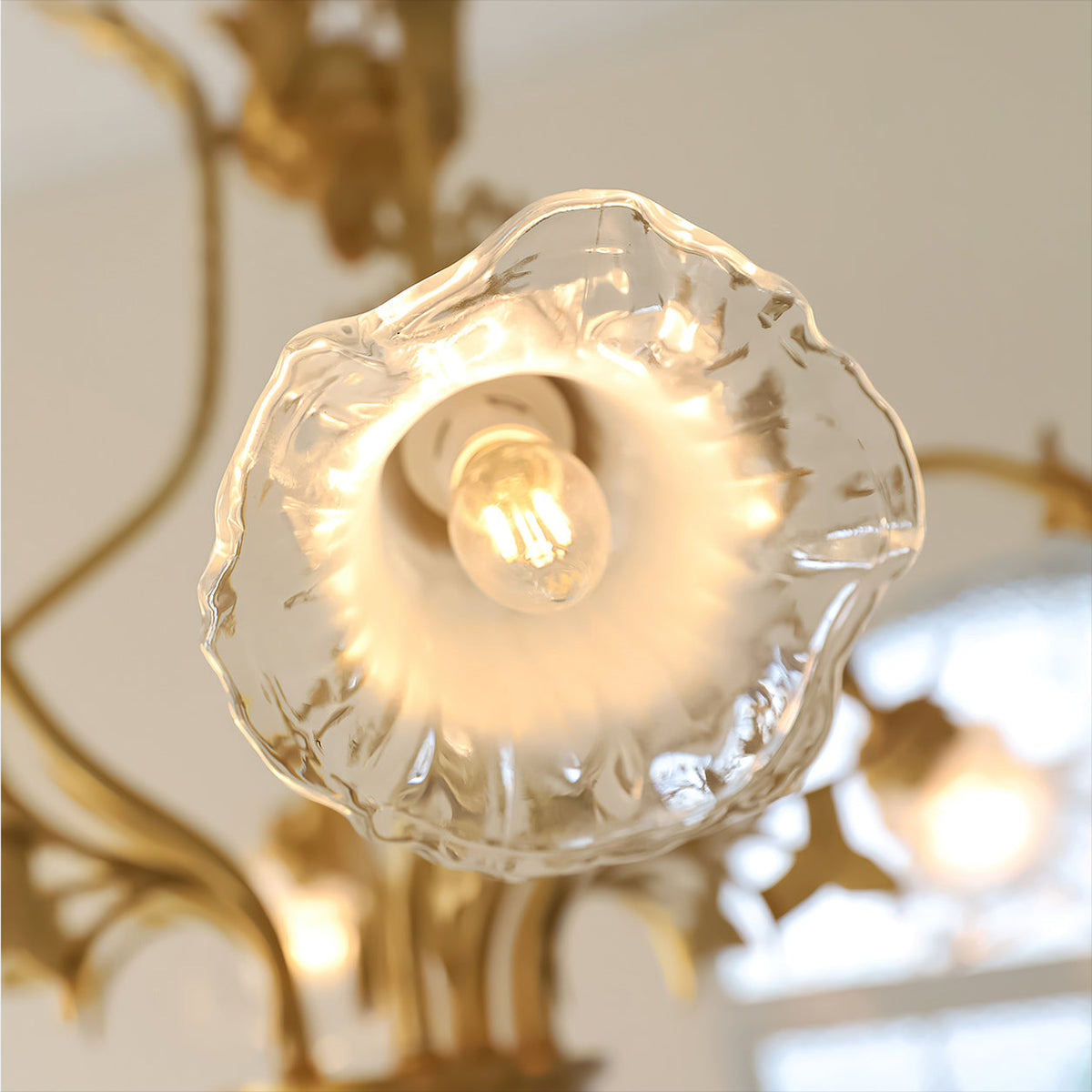 The chandelier with lights off, highlighting its sculptural form.
