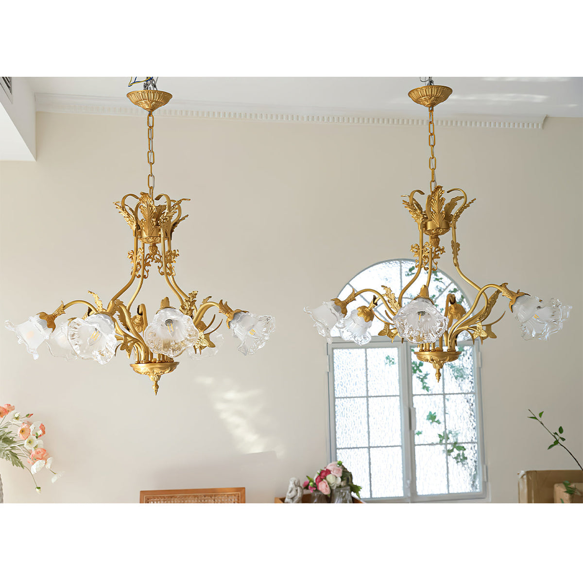 The chandelier with lights on, creating a romantic ambiance.