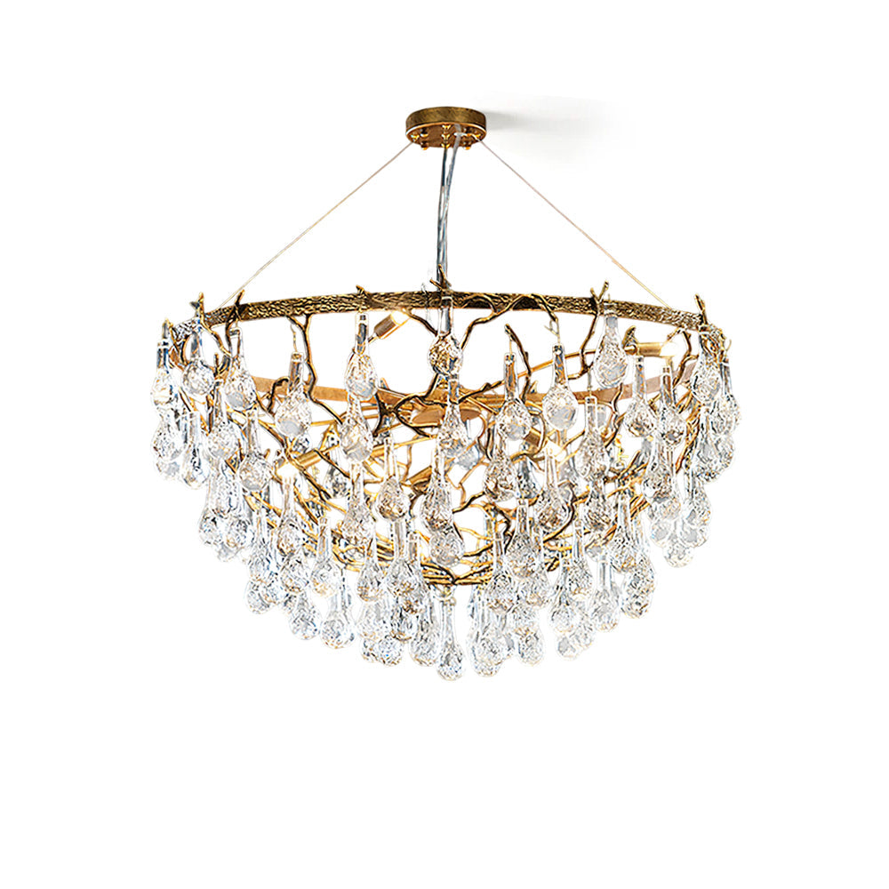 Doris Chandelier with antique brass finish and cascading crystal drops, shown lit.