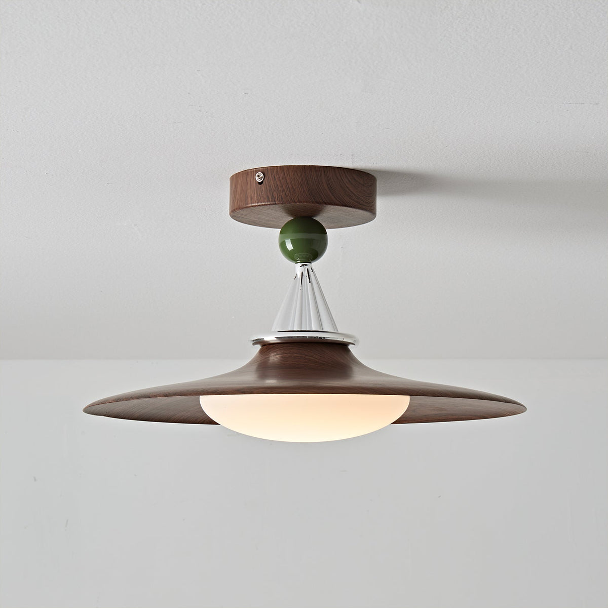 Eden Ceiling Light shown illuminated, casting a warm light.