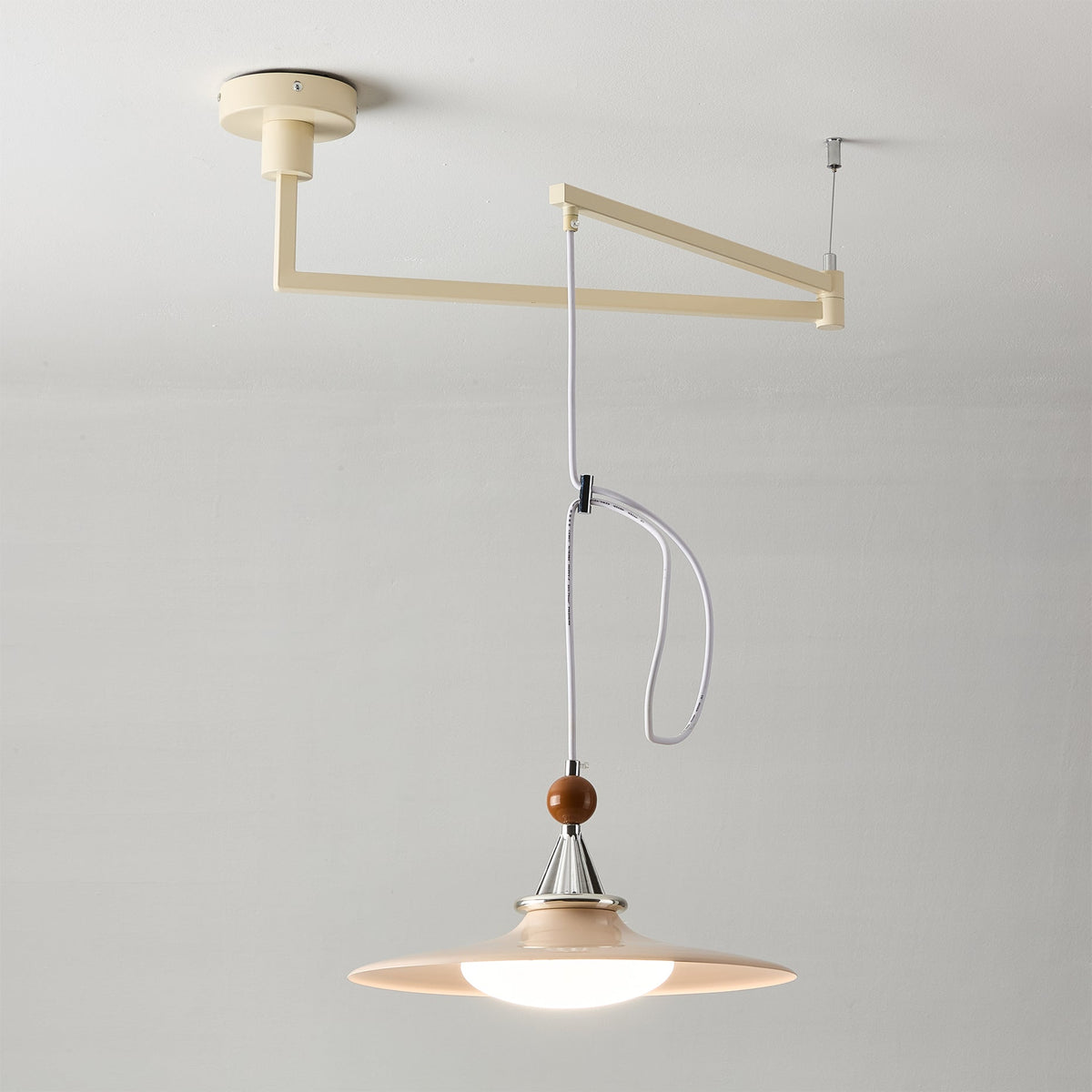 Eden pendant light hanging over a dining table.