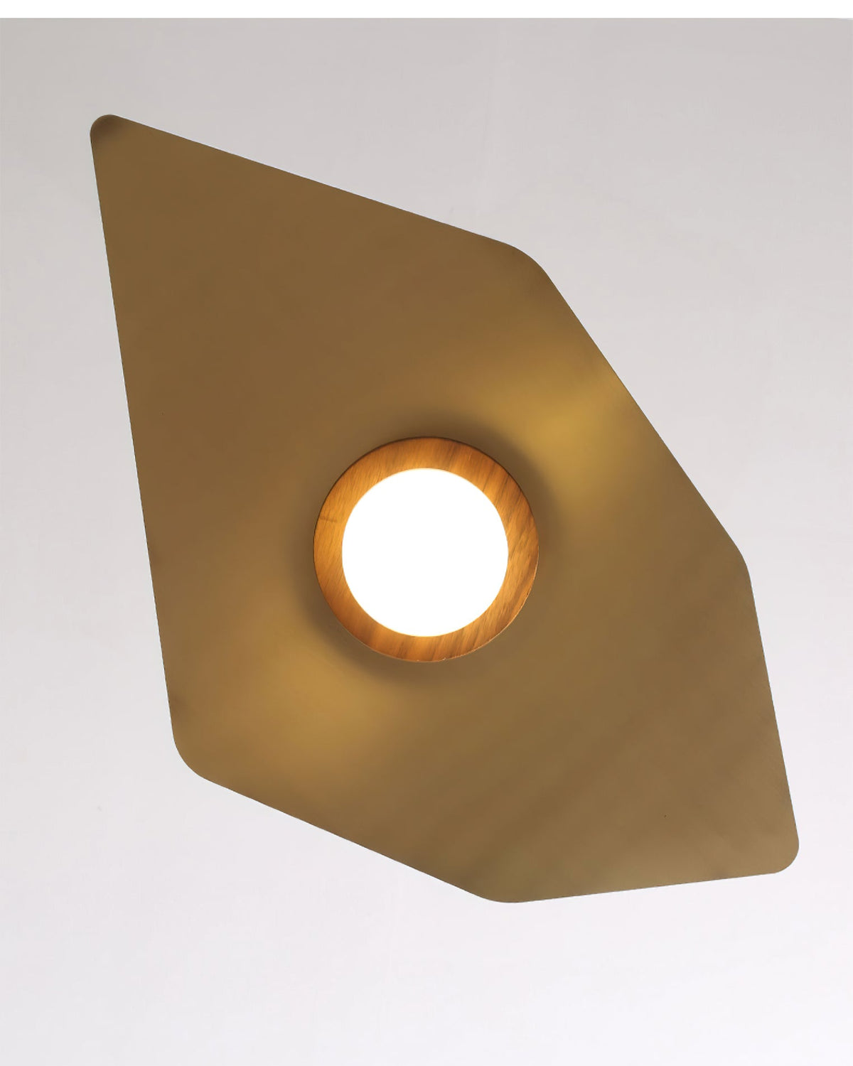The sleek brass finish of the Elara Pendant Lamp's shade reflecting light.