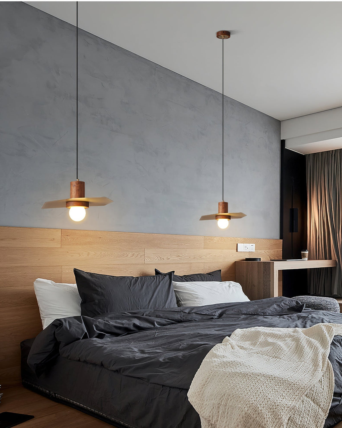 View from below the Elara Pendant Lamp, highlighting its geometric brass shade.
