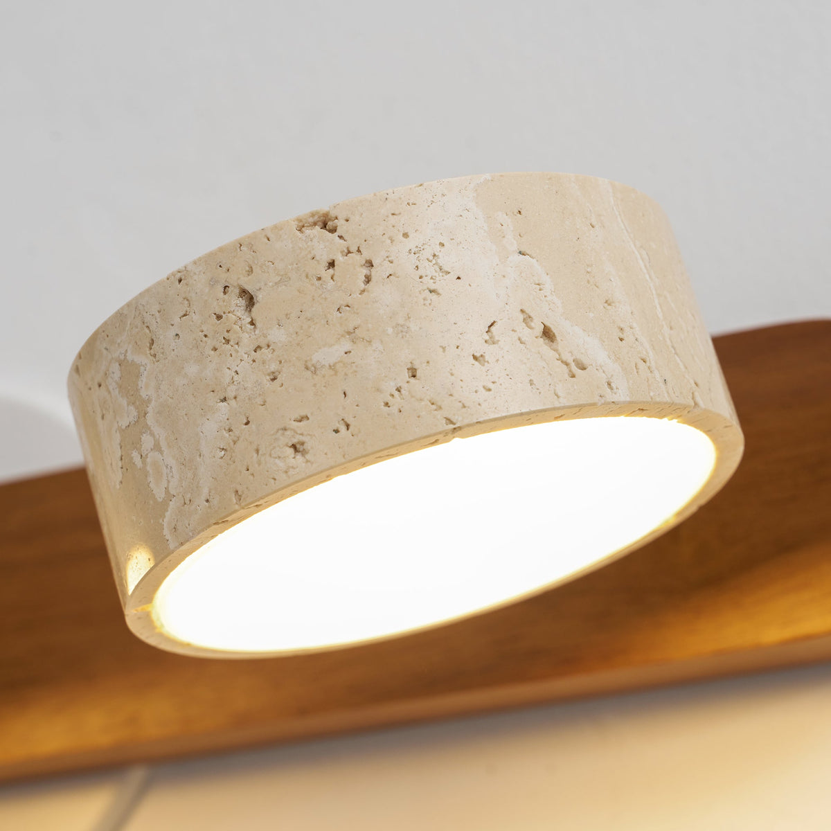 The lamp's reflection on a glossy surface.
