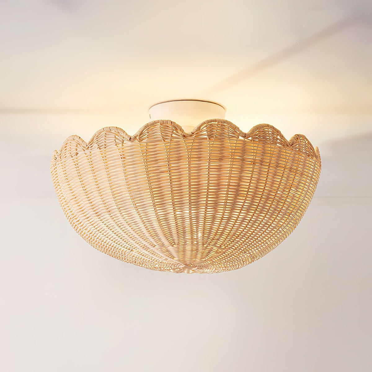 Close-up of the natural raffia weave on the Elior ceiling light.