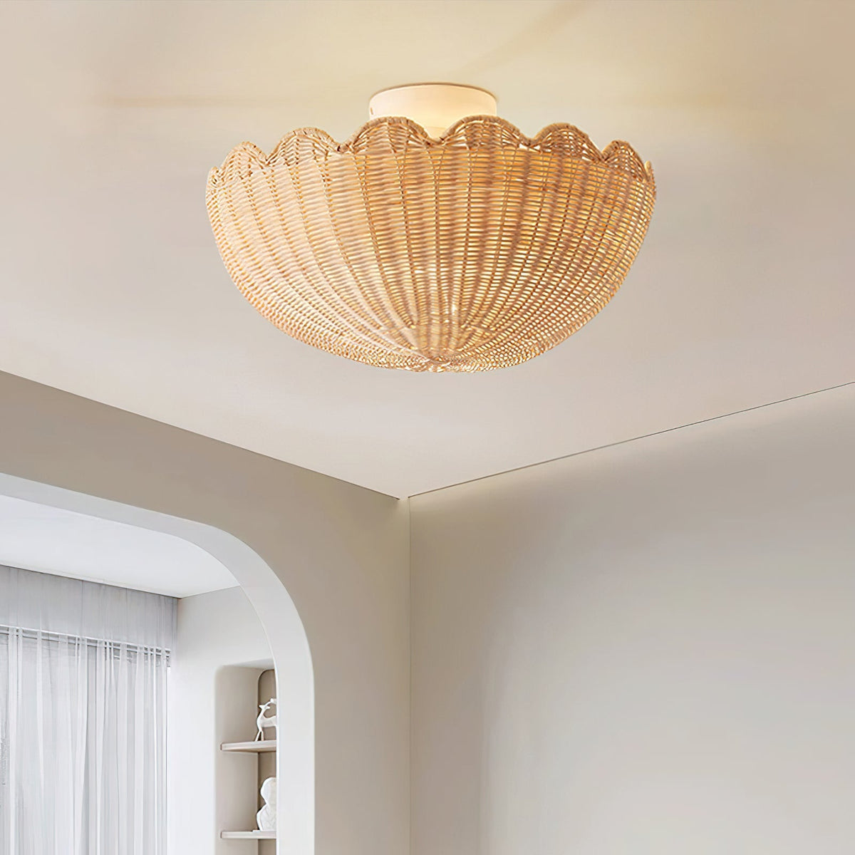 A large Elior ceiling light installed over a wooden dining table.