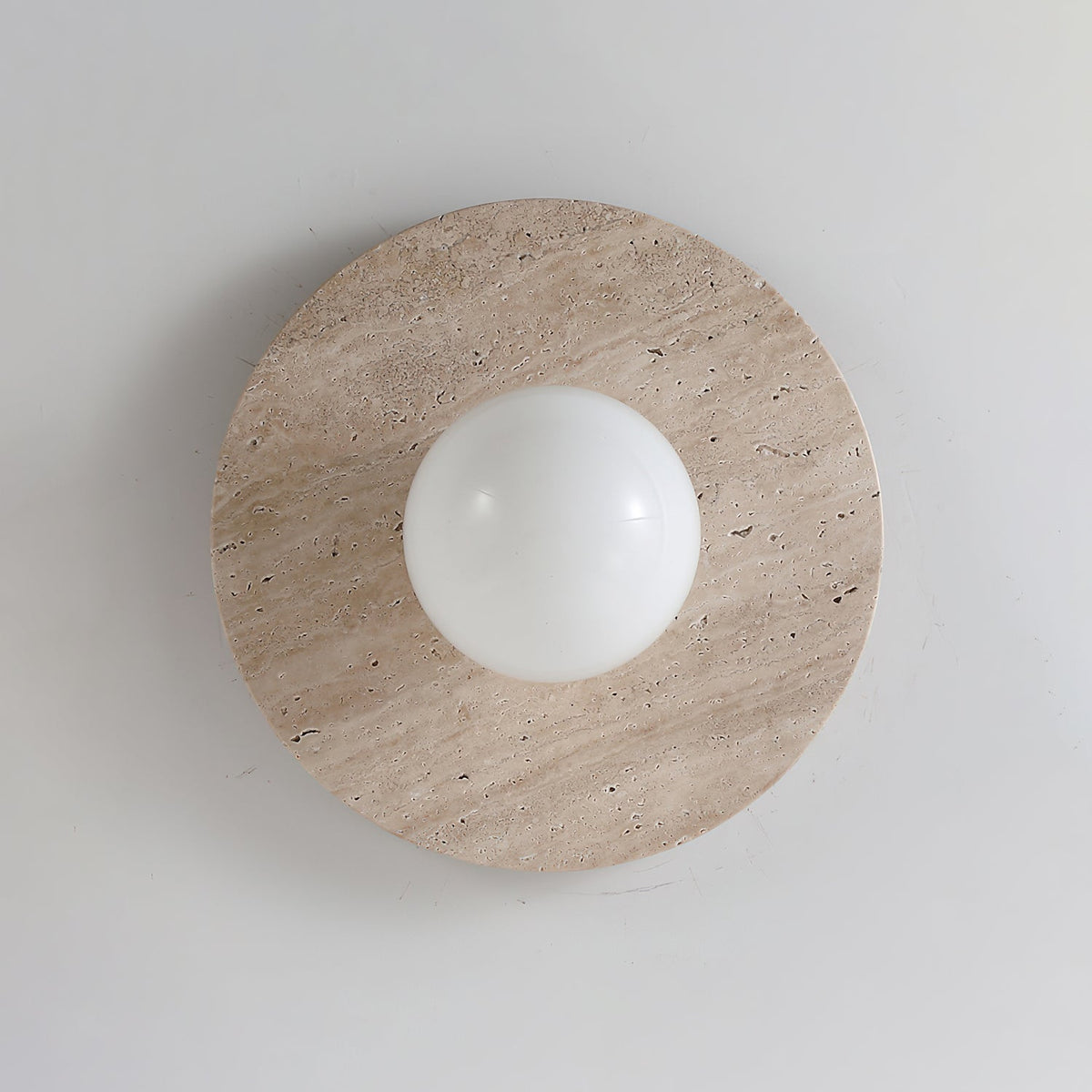 Unlit Elira Travertine Wall Lamp against a neutral background.