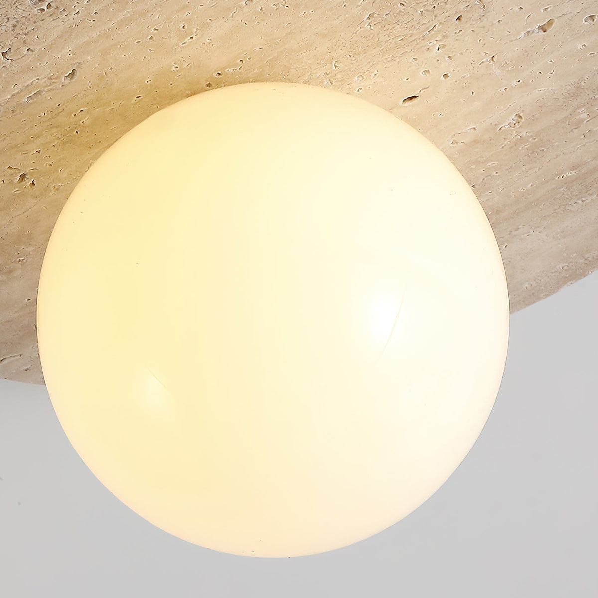 Lifestyle image of the Elira Wall Lamp in a contemporary bedroom.