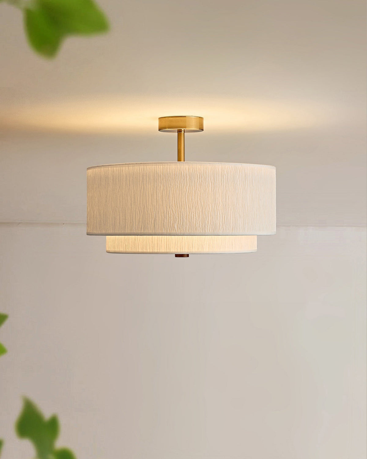 The light fixture installed in a Japandi-style bedroom.