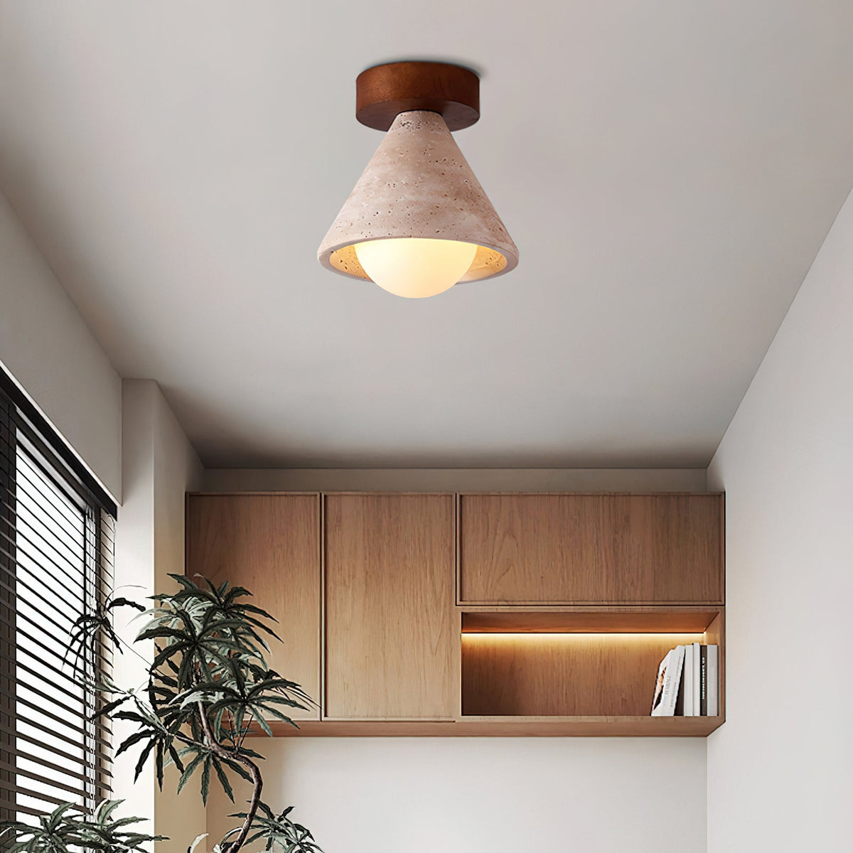 Close-up view of the Emmet Ceiling Light's travertine texture and wood accent.