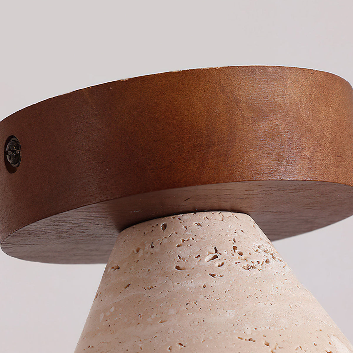 Detail of the wood top and travertine shade of the Emmet Ceiling Light.