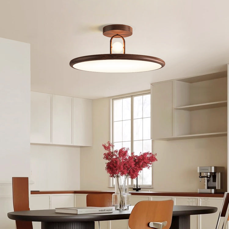 Close-up of the Envostar ceiling lamp's acrylic diffuser and metal frame.