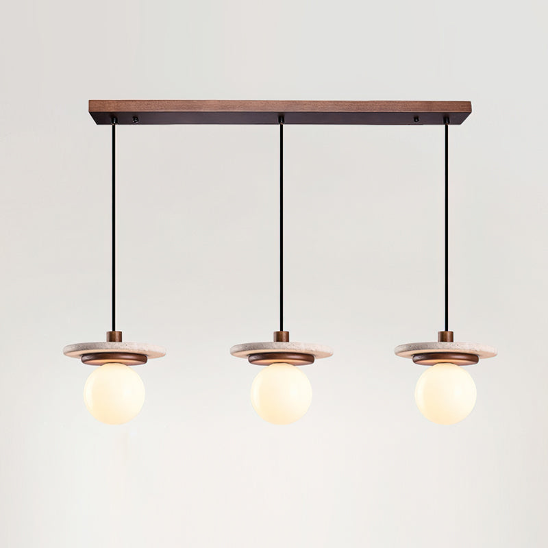 The Farren pendant light shown against a neutral wall, highlighting its organic modern style.