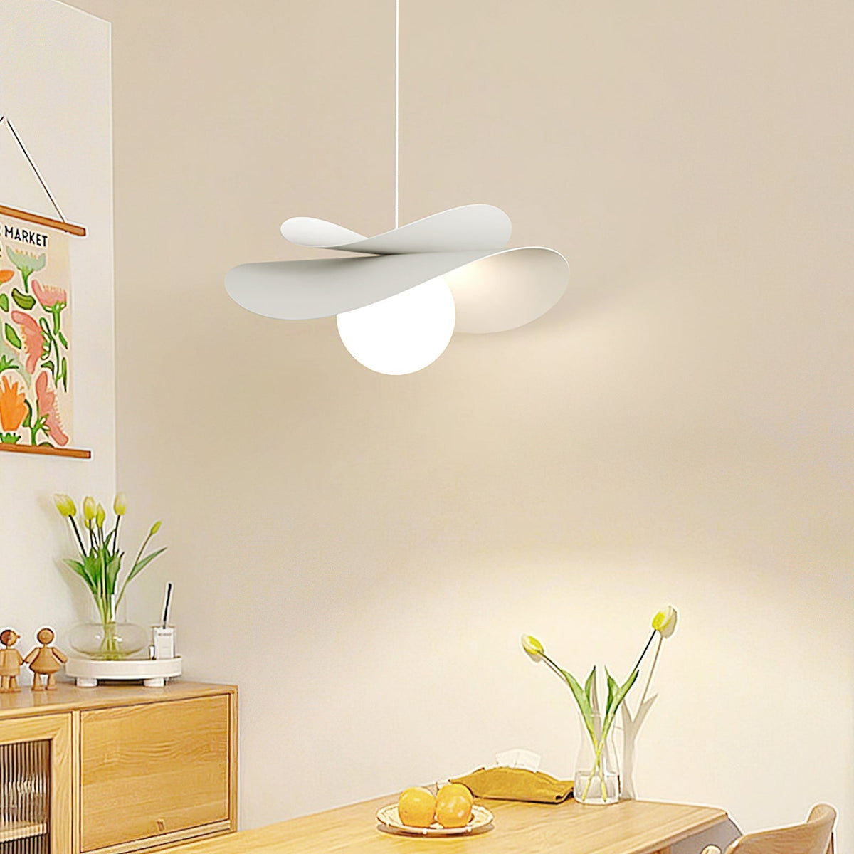 Angled view of the white Fiksa Pendant Lamp against a dark background.