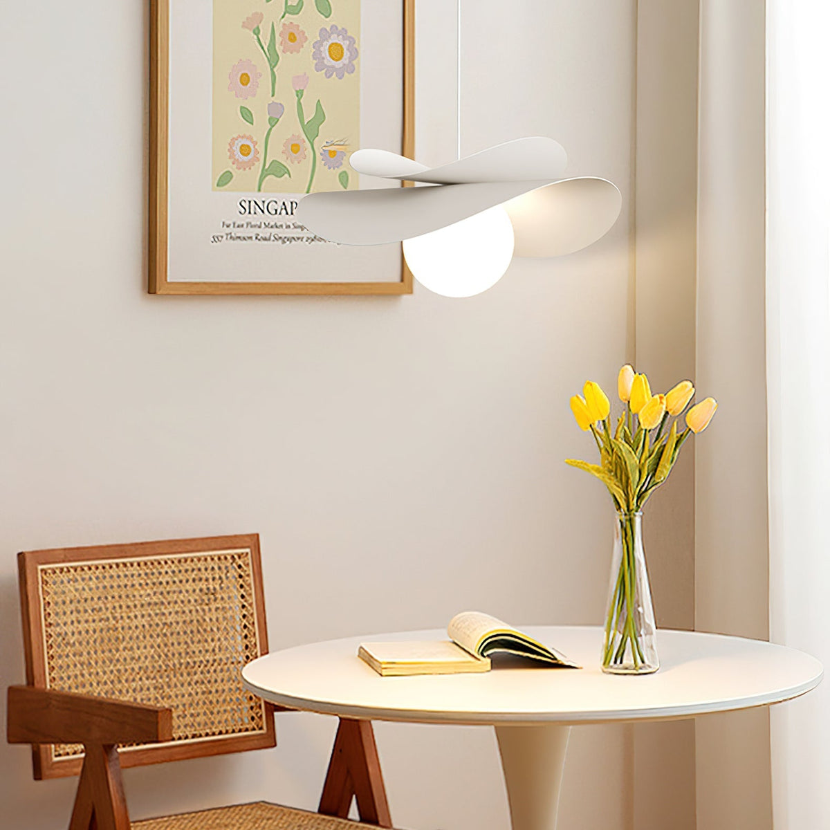 Side view of the Fiksa Pendant Lamp, highlighting its sculptural metal form.