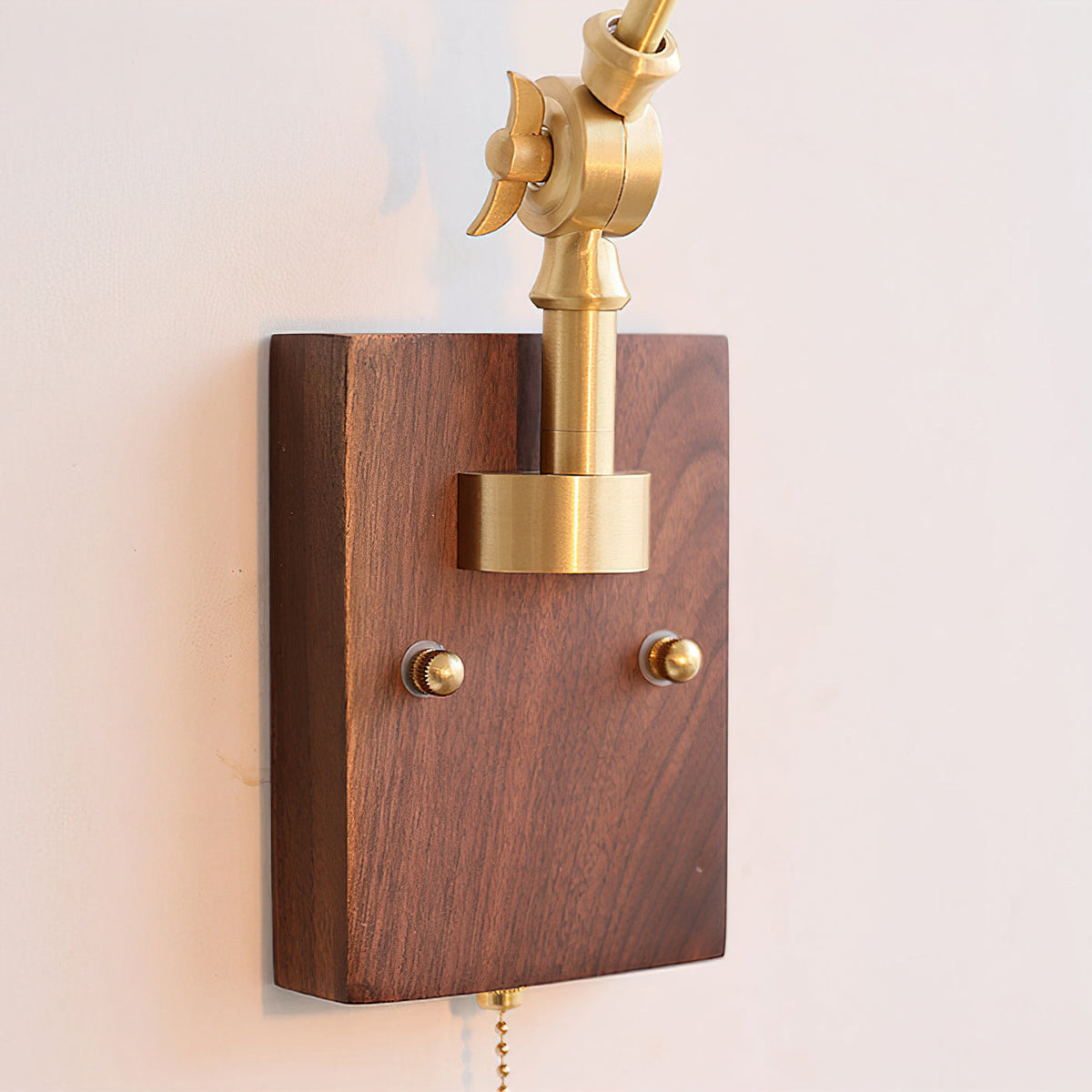 View of the wall mounting plate and wooden components of the Fleka lamp.