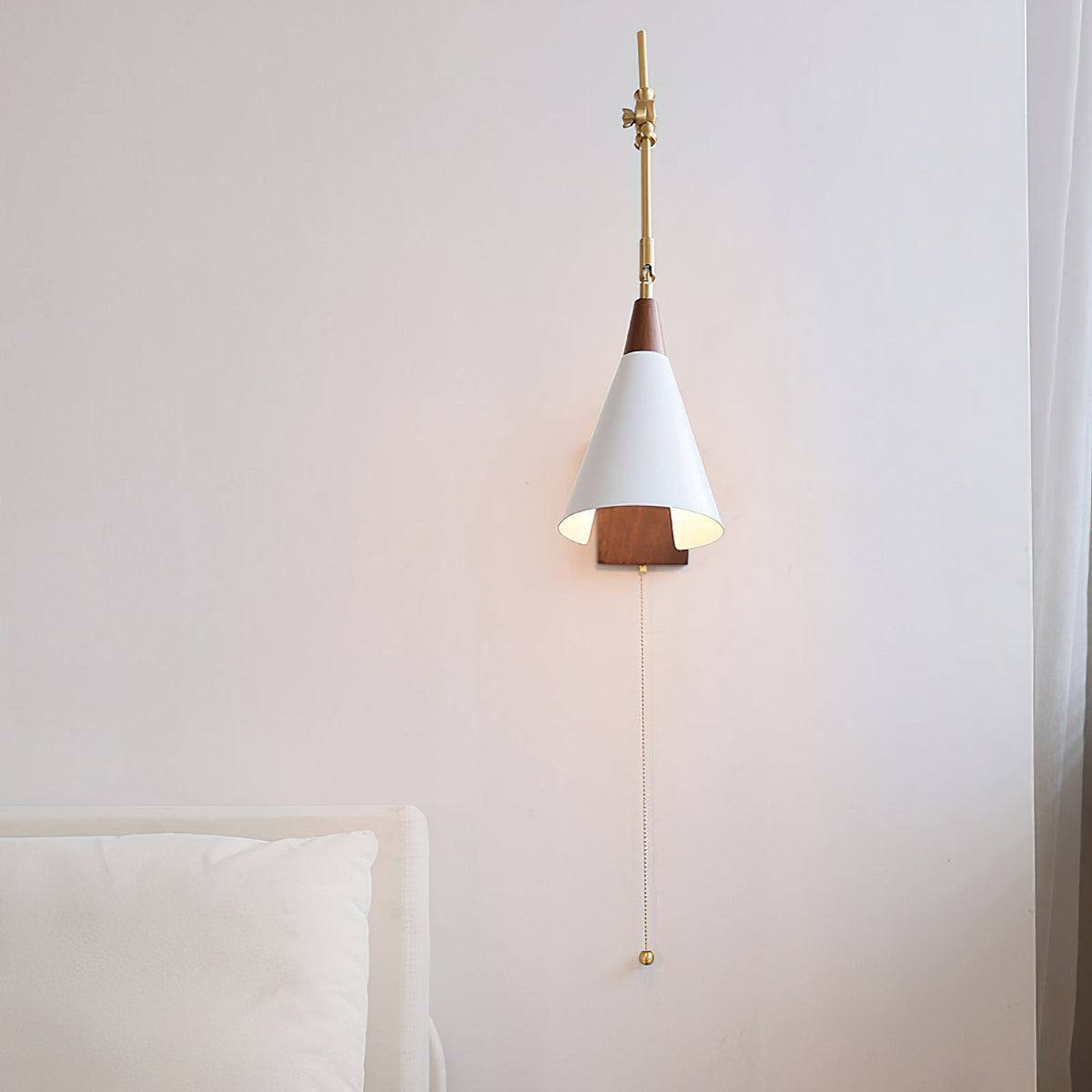 Detail shot of the white lamp shade and brass hardware.