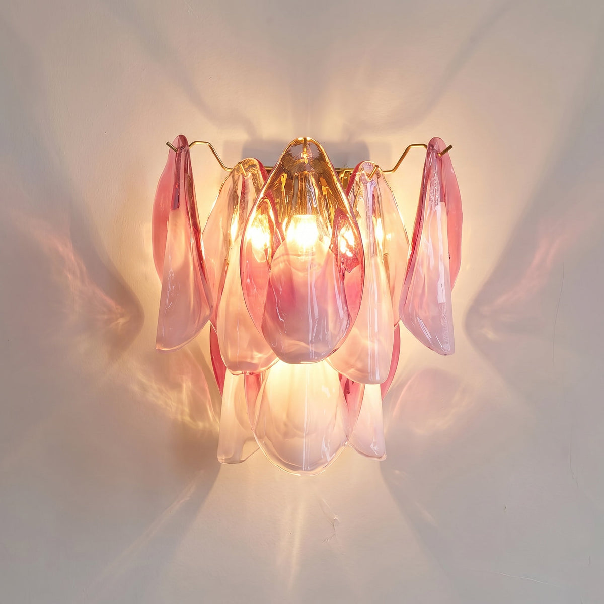 Foliage Wall Sconce in white glass for a minimalist look.