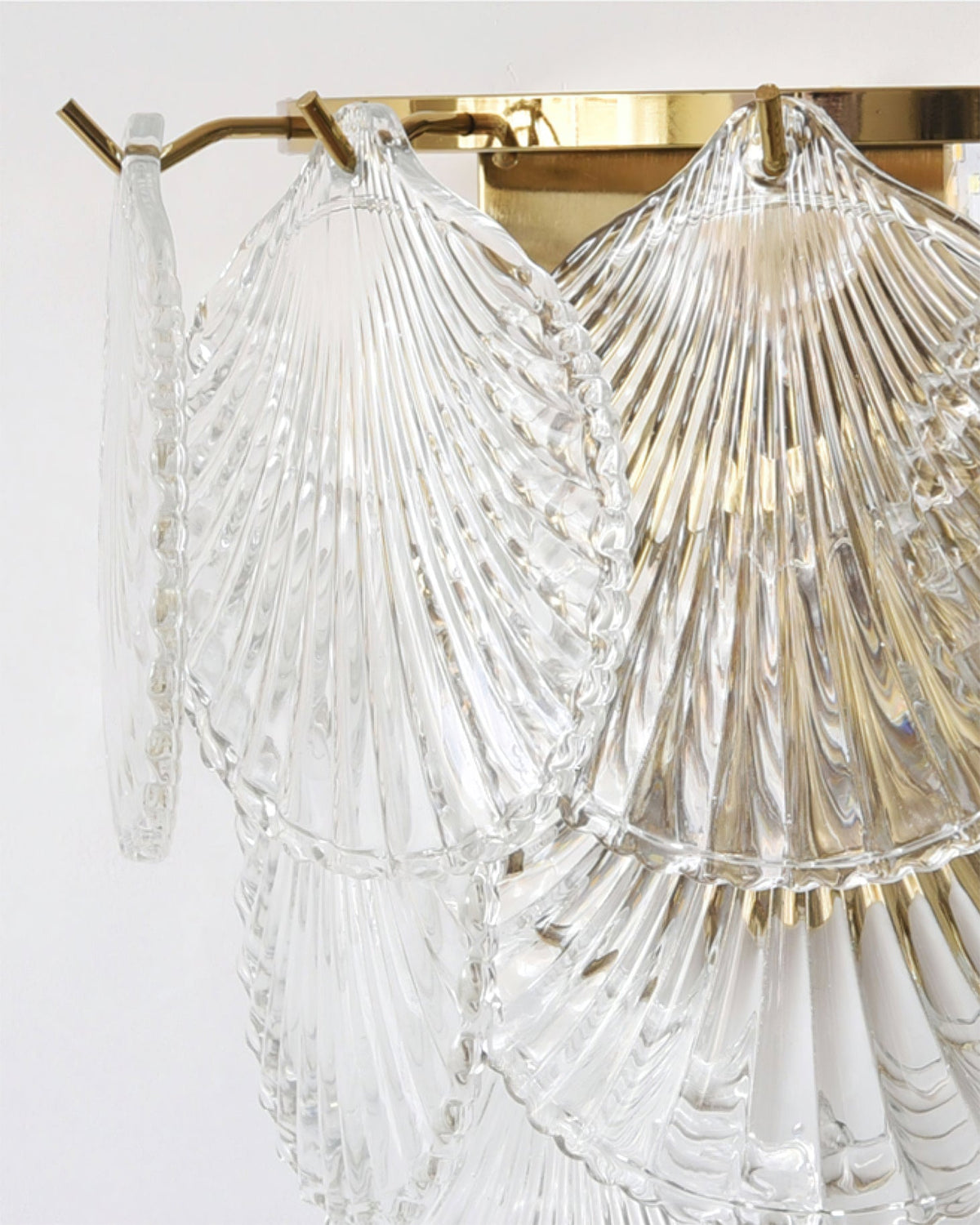 The Galerie Wall Lamp installed above a side table.