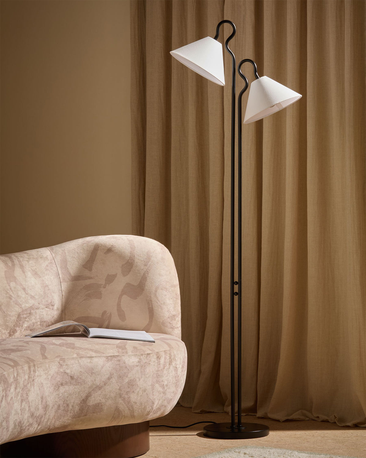 The slender metal stem and sturdy base of the Gerardo Floor Lamp.