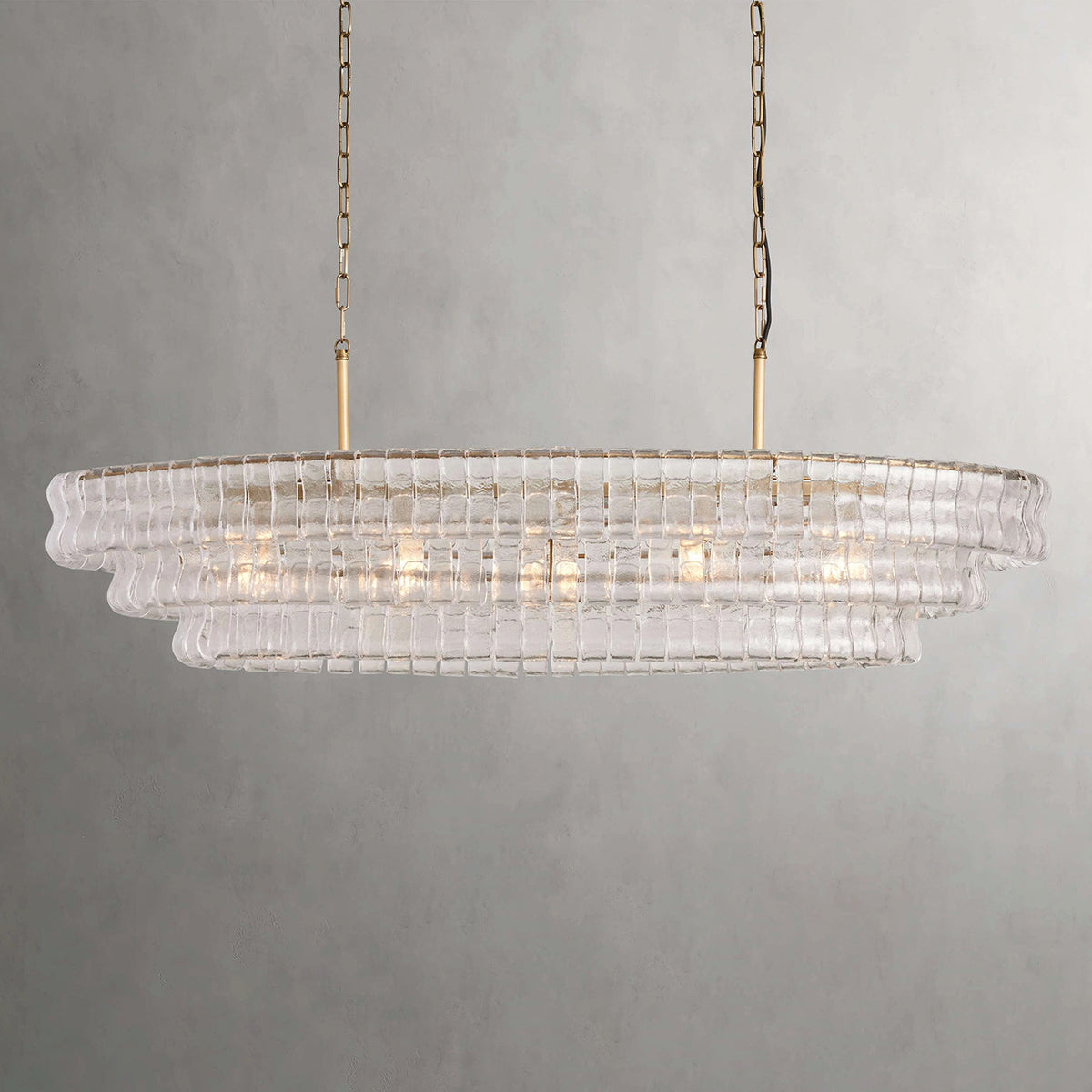 A green glass version of the Albano Chandelier in a modern living space.