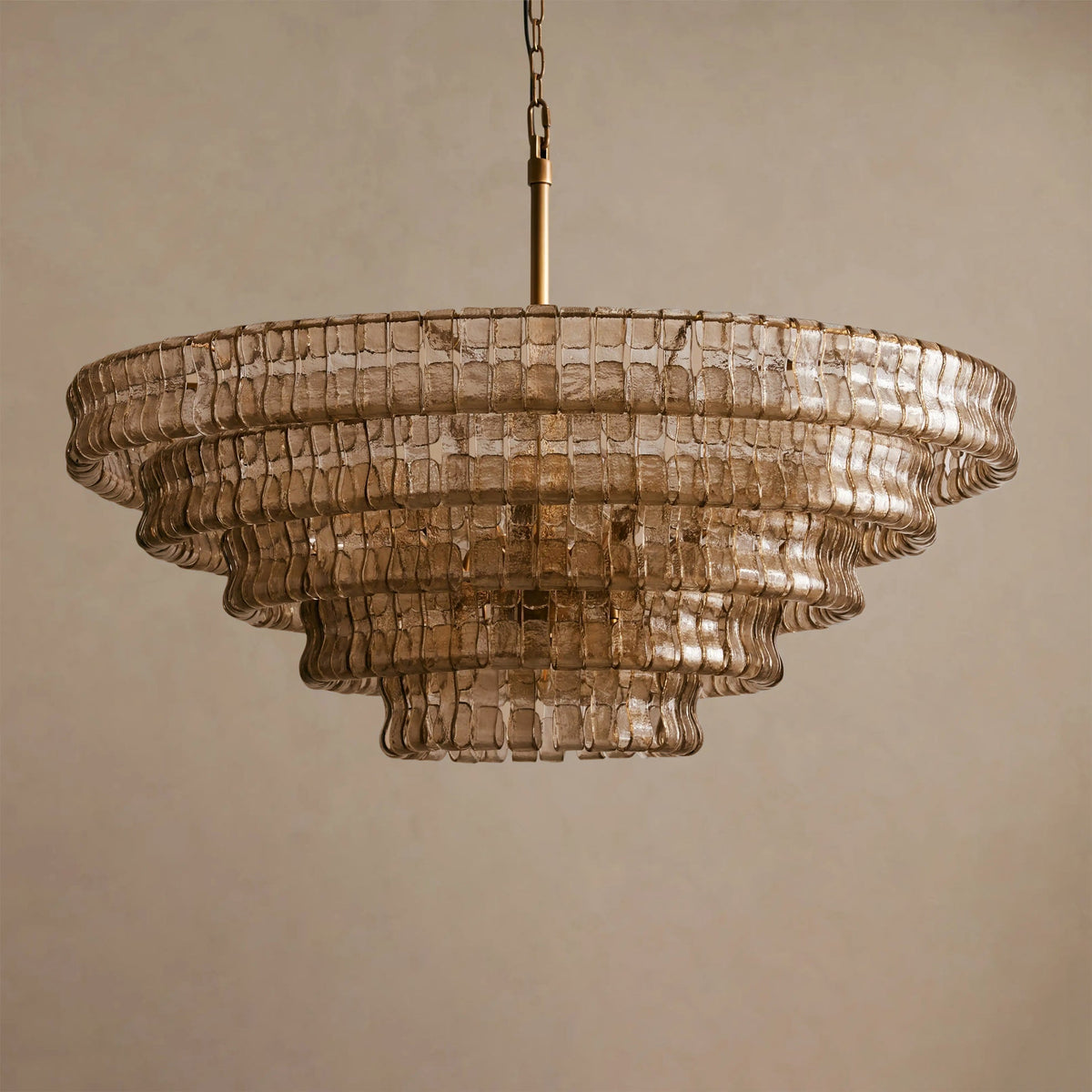 The ambient light cast by the Ghiaccio Chandelier in a dimly lit room.