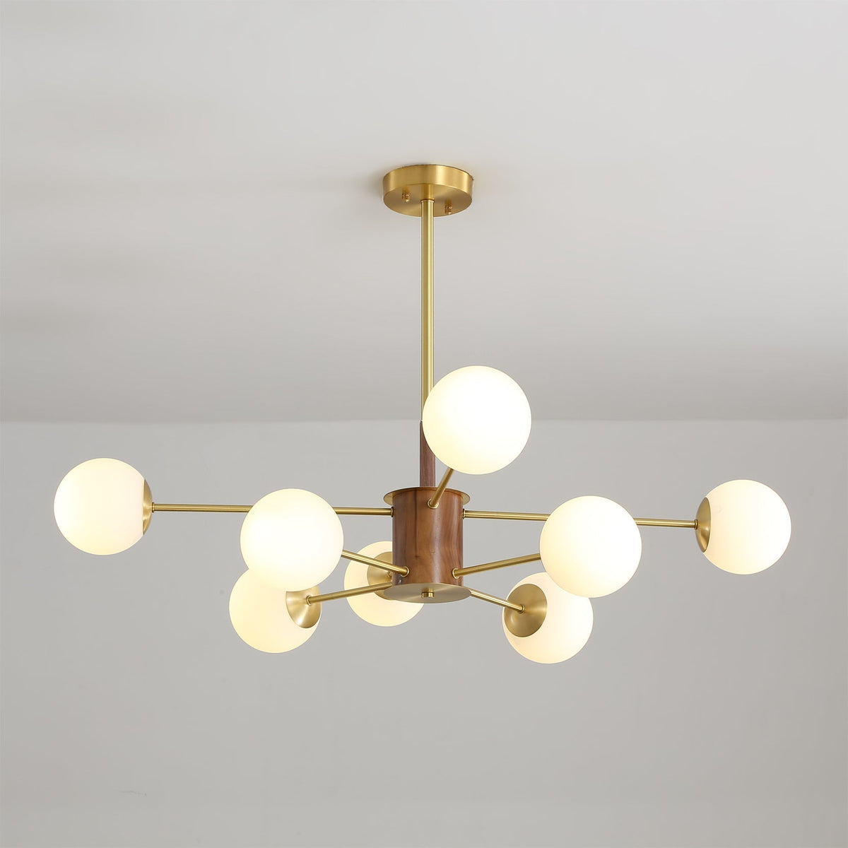Detail of the brass finish on the chandelier's arms.