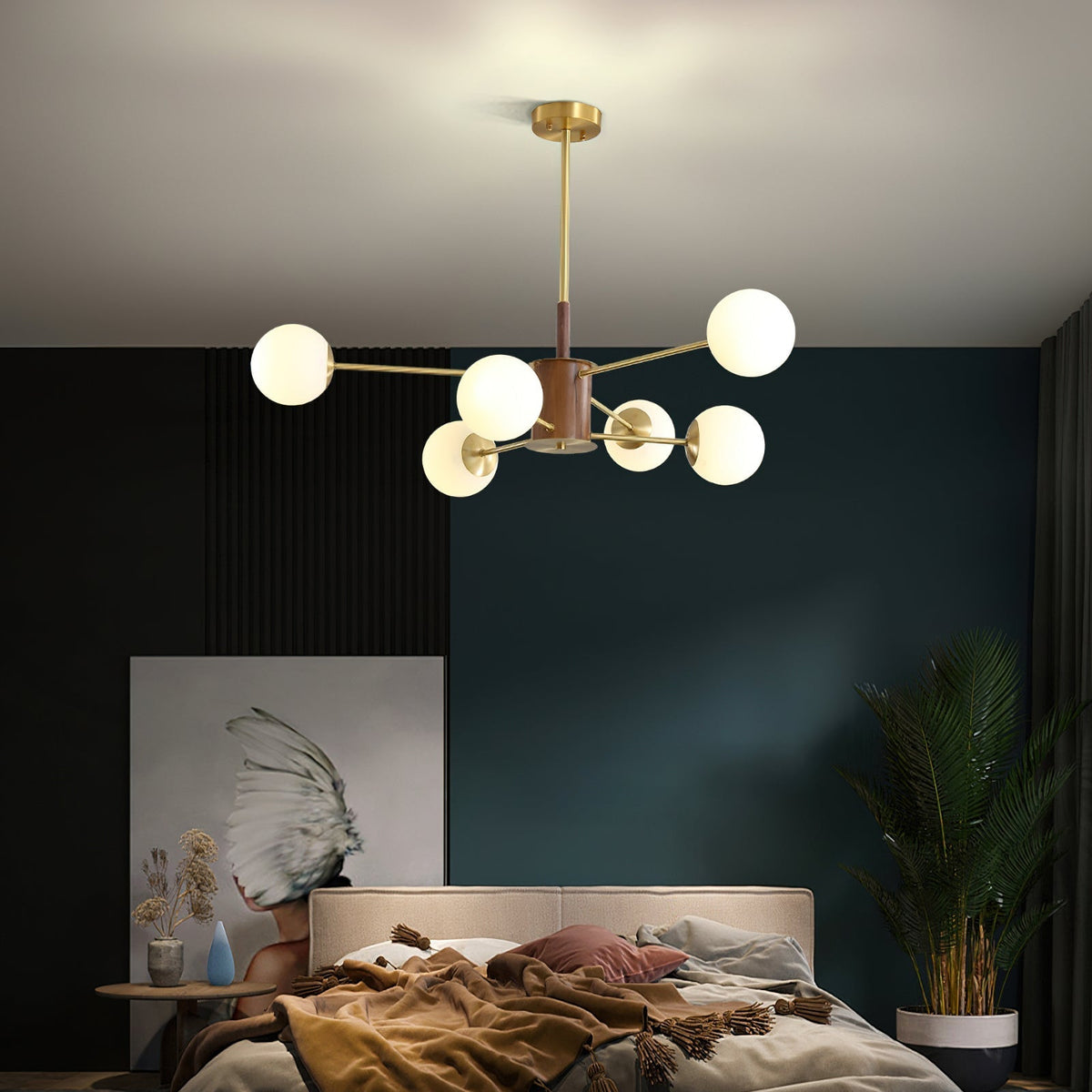 Detail shot of the brass arms and central wooden hub of the Gino Chandelier.