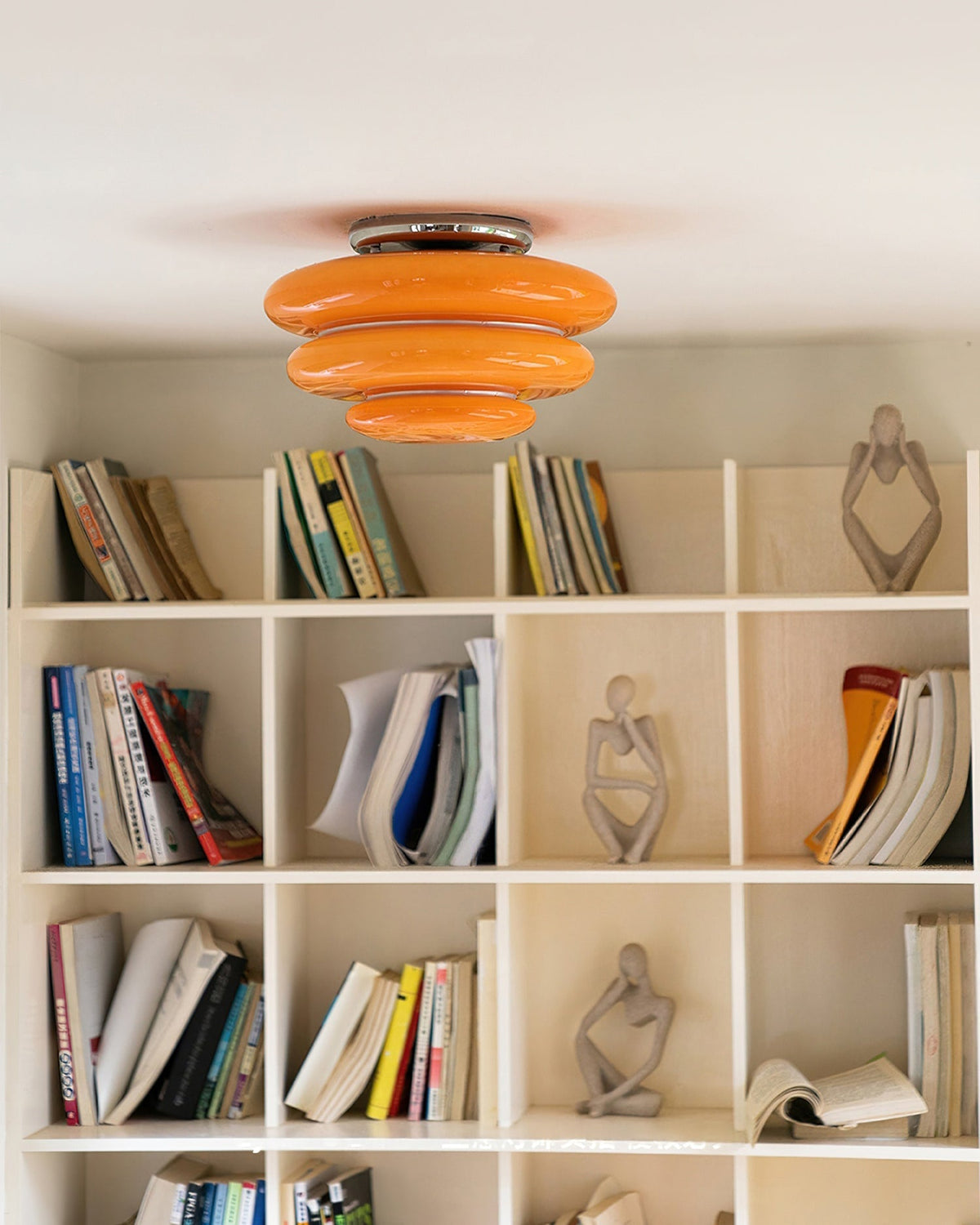 The Gispen Ceiling Light illuminated, casting a warm and inviting glow.