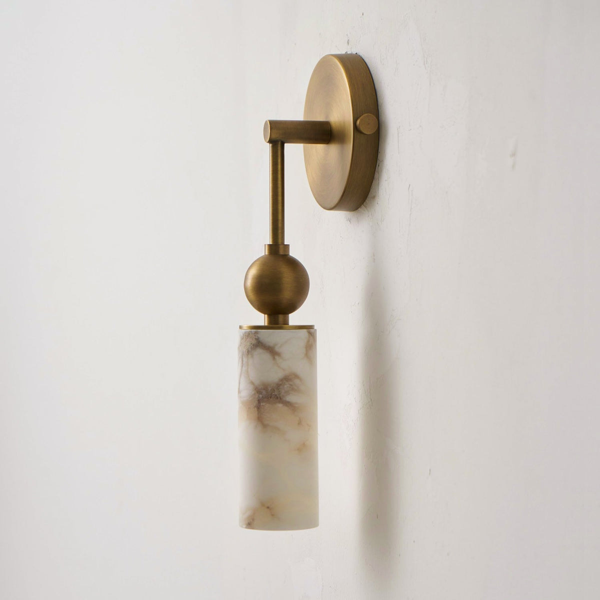 The Metro Alabaster Wall Lamp, 2-head version, turned on.