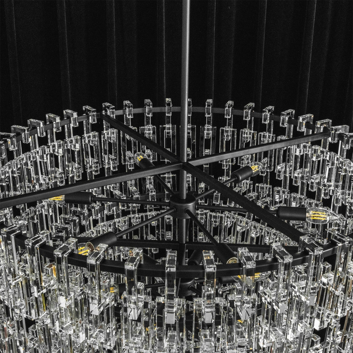 Lifestyle image of the chandelier in an open-concept living space.