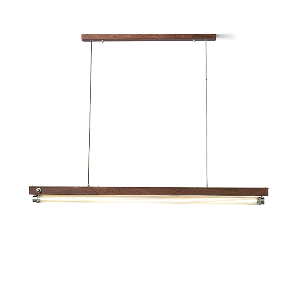 Hiromi Linear Chandelier in walnut finish hanging over a modern dining table.