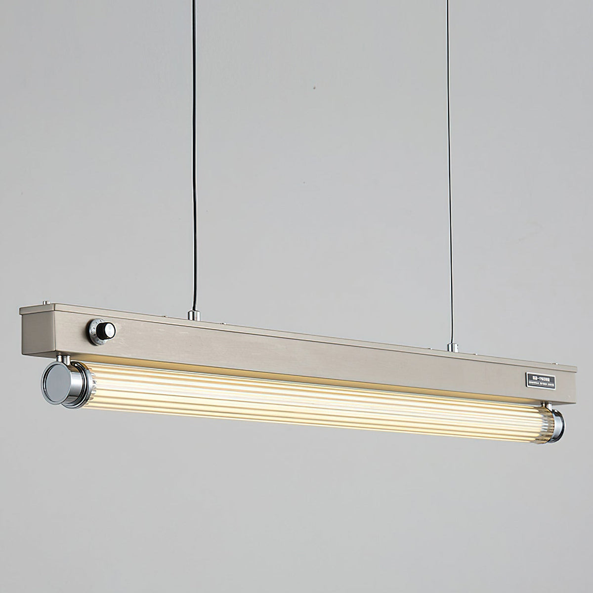 Detailed shot of the rich wood-grain finish on the elongated body of the Hiromi Chandelier.