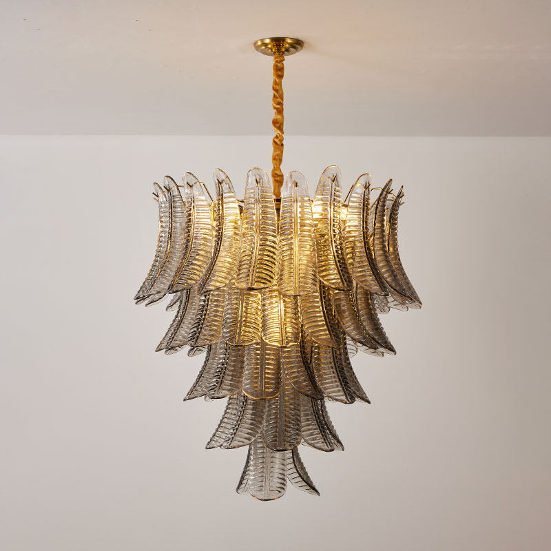The smoke gray glass variant of the Isolde Chandelier against a light-colored wall.