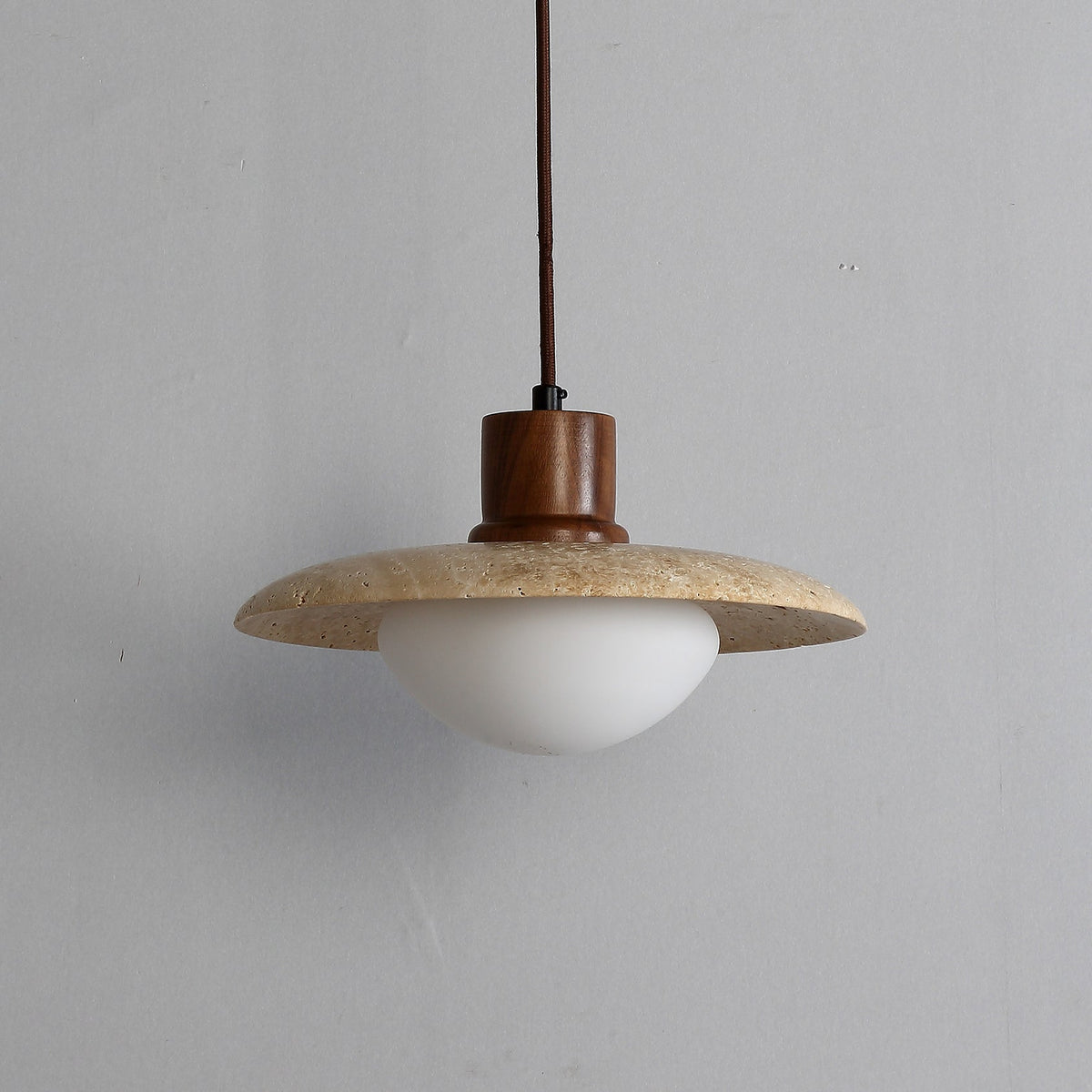 The Jadssox pendant lamp shown from a side angle against a neutral background.