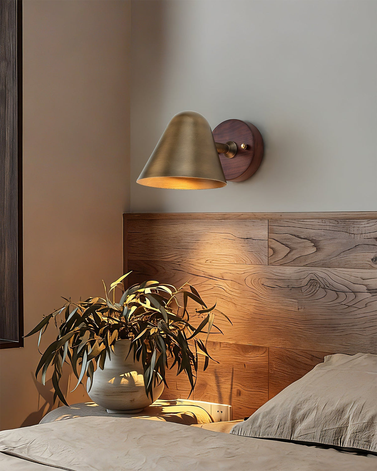 Close-up of the Janna Wall Lamp's brushed brass texture.