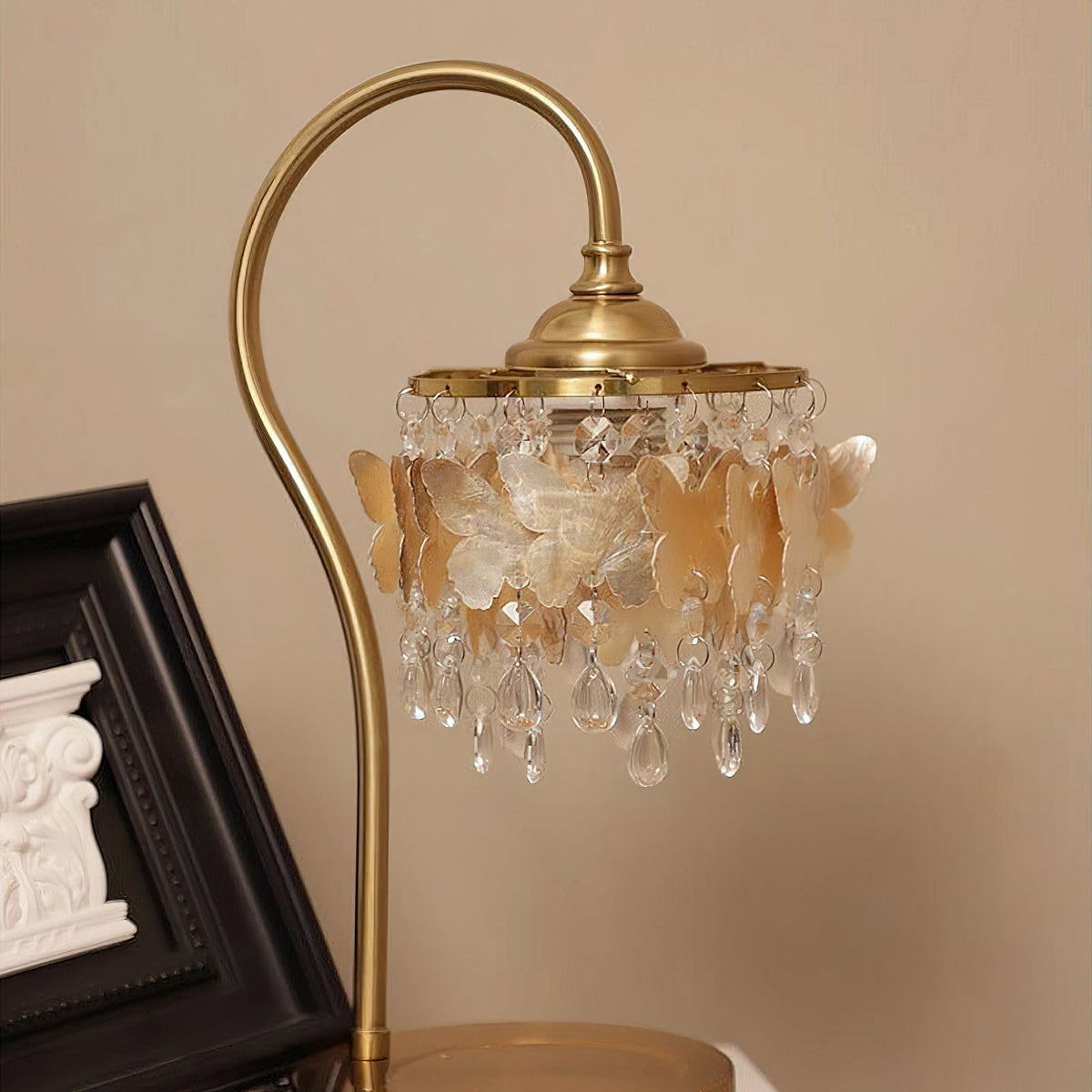 The Jasinski Table Lamp illuminated, casting a warm and enchanting glow.